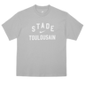 The Nike Stade Toulousain 25/26 Premium Loose-Fit T-Shirt is a grey cotton tee with "STADE TOULOUSAIN" boldly printed in white on the front.
