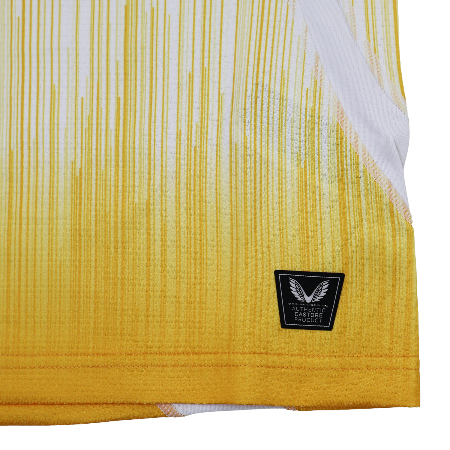 Close-up of the Leinster 25/26 Away Pro Shirt by Castore, a yellow and white jersey with vertical gradient lines, black patch label on the lower hem, and crafted from high-performance technical fabric.