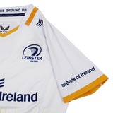 The Leinster 25/26 Away Pro Shirt by Castore is a pro-grade white jersey with yellow trim, made from technical fabric, and features Castore, Bank of Ireland, and Leinster Rugby logos.