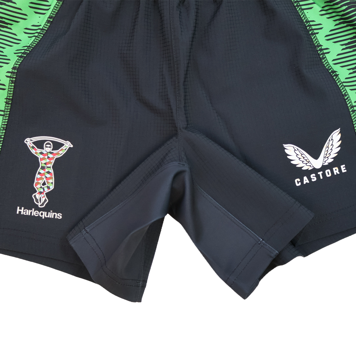 Harlequins 22/23 Home Shorts by Castore: Black shorts with the Harlequins logo on the left leg, Castore branding on the right, and bold green patterned side panels.