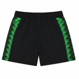 The Castore Harlequins 22/23 Home Shorts feature black fabric with green zigzag side panels, inspired by the club's classic style, and are displayed flat on a white background.