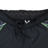 Close-up of the waistband on the Castore Harlequins 22/23 3rd Pro Short, showing a drawstring, elastic band with a wavy pattern, and green accent lines on the sides.