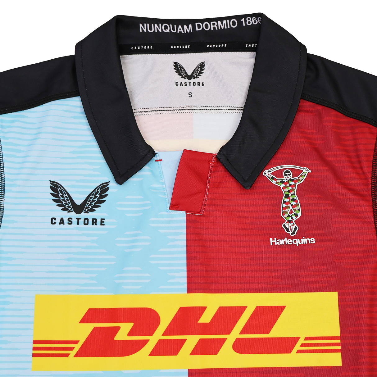The Harlequins Replica Home Jersey 22/23 by Castore features blue and red panels, DHL sponsor logo, club crest, and a collar with "NUNQUAM DORMIO 1866"—a must-have for passionate fans.