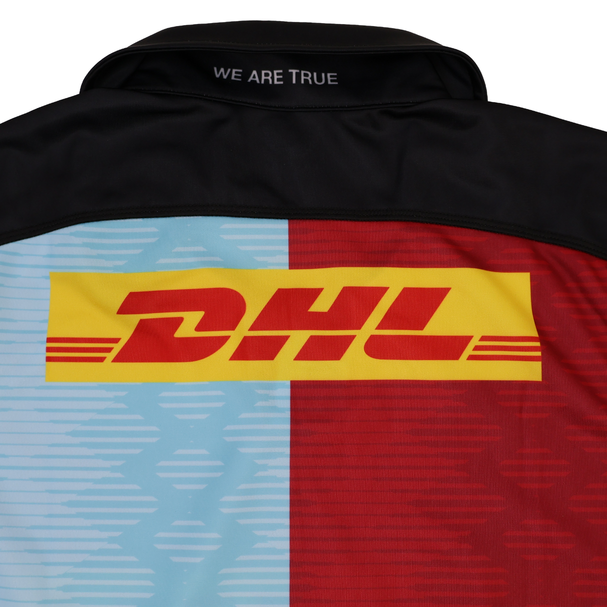 The Castore Harlequins Replica Home Jersey 22/23 features "WE ARE TRUE" on the collar, blue and red Harlequin-inspired panels, and a bold yellow and red DHL logo across the back.