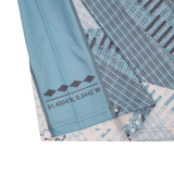 A close-up of the Harlequins Replica Away Jersey 22/23 by Castore, showing its blue geometric pattern, white accents, and printed coordinates: 51.4504°N, 0.3442°W.