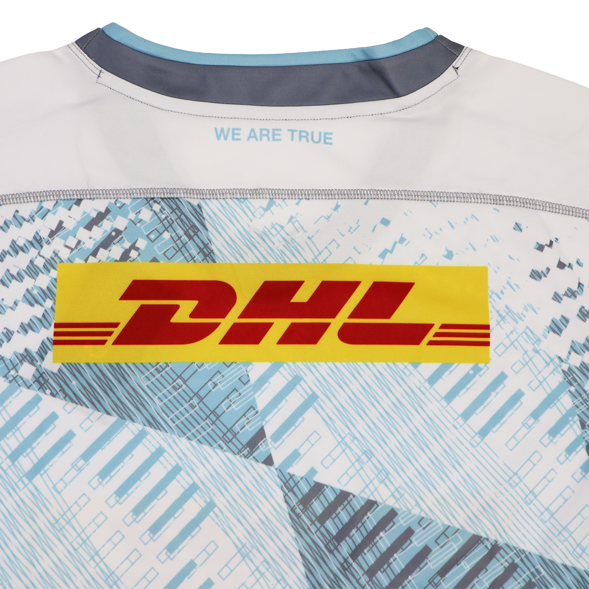 Back of the Harlequins Replica Away Jersey 22/23 by Castore, featuring a yellow DHL logo, "WE ARE TRUE" near the collar, and a blue and white geometric pattern inspired by Castore’s design.