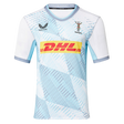 The Harlequins Replica Away Jersey 22/23 by Castore features a white and light blue geometric pattern, DHL sponsor logo, Castore branding, and club crest on the chest—a perfect rugby jersey for fans.