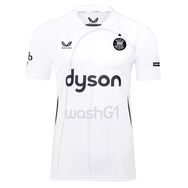 The Bath Rugby 25/26 Away Jersey by Castore is a white short-sleeve top with black "dyson" and "washG1" logos on the front, plus additional sponsor logos on the sleeves and chest.