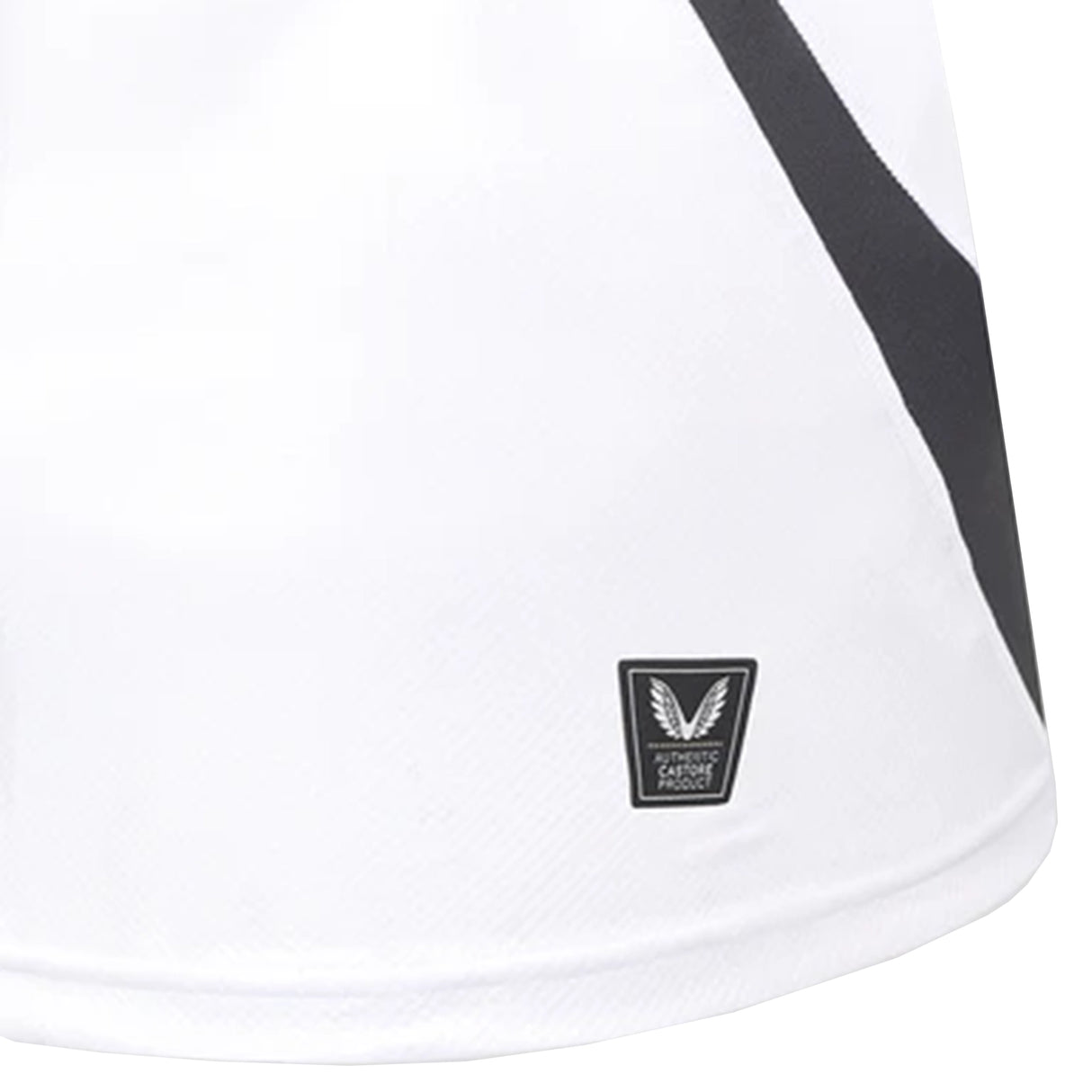 Close-up of the Bath Rugby 25/26 Away Jersey by Castore, showing a black diagonal stripe and a small rectangular authenticity label near the hem.