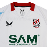 The Ulster 25/26 Pro Home Jersey by Castore is a white performance rugby jersey with a red collar and "SAM Home of MDF Mouldings" as the front sponsor.