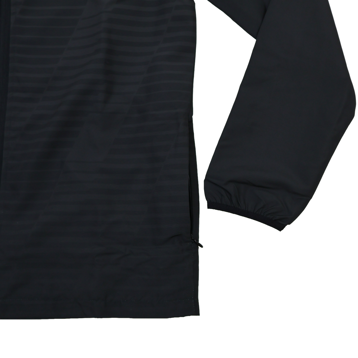 A close-up of the lower section of the Ulster 25/26 Woven Pre Match Jacket by Castore, in black, featuring a zipper and elastic cuff, shown against a plain white background.