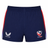 The USA Rugby Pro Home Short 22/23 by Castore features navy blue fabric with red and white side panels, plus the Castore logo on the left and the USA Rugby logo on the right—ideal for rugby fans.