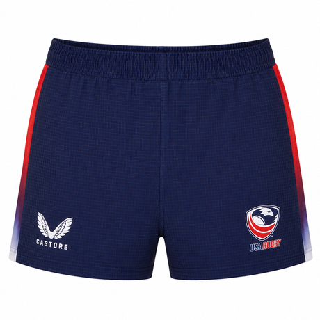 The USA Rugby Pro Home Short 22/23 by Castore features navy blue fabric with red and white side panels, plus the Castore logo on the left and the USA Rugby logo on the right—ideal for rugby fans.