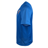 Side view of the blue USA Rugby Training Jersey by Castore, highlighting its athletic fit and front logo.