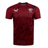 The USA Rugby Printed Training Tee by Castore is maroon with dark sublimated designs, featuring the USA Rugby logo and Castore emblem on the chest.