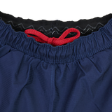 Close-up of the waistband on USA Rugby 22/23 7's RWC Away Pro Short by Castore, featuring a red drawstring and a black inner lining with wavy silicone grip.