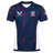 The USA Rugby 23/24 Pro Home Jersey by Castore is a blue men's rugby shirt with red and white accents, featuring the Castore logo, USA Rugby logo, and an American flag patch on the right sleeve—ideal for fans.