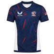 The USA Rugby 23/24 Pro Home Jersey by Castore is a blue men's rugby shirt with red and white accents, featuring the Castore logo, USA Rugby logo, and an American flag patch on the right sleeve—ideal for fans.