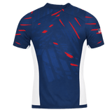Back view of the USA Rugby 23/24 Pro Home Jersey by Castore: navy blue short-sleeve shirt with red accents, white side panels, and a small American flag on the right sleeve, inspired by pro home rugby style.