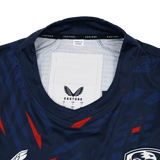 Close-up of the collar and inner label of the USA Rugby 23/24 Pro Home Jersey by Castore, featuring sizing details and a "Made in China" tag.