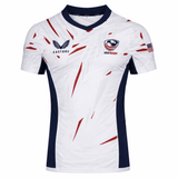Show your pride in the USA Rugby 23/24 Pro Away Jersey by Castore, featuring navy accents, bold red streaks, USA Rugby and Castore logos on the chest, and an American flag on the right sleeve—a must-have for fans and players.