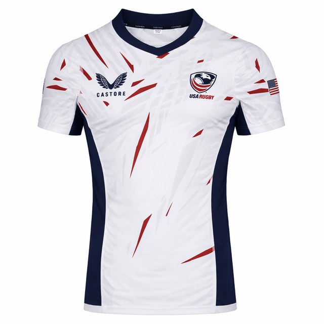 Show your pride in the USA Rugby 23/24 Pro Away Jersey by Castore, featuring navy accents, bold red streaks, USA Rugby and Castore logos on the chest, and an American flag on the right sleeve—a must-have for fans and players.
