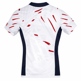 The USA Rugby 23/24 Pro Away Jersey by Castore features short sleeves, white fabric with red accents, navy side panels, and a subtle geometric back pattern for an authentic fan look.