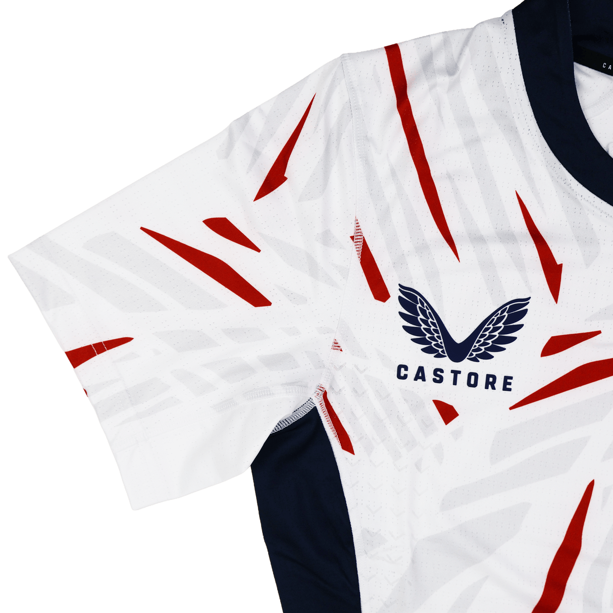 The USA Rugby 23/24 Pro Away Jersey by Castore features a white base, red diagonal stripes, navy blue collar, and the signature Castore winged logo—an eye-catching choice for rugby fans.