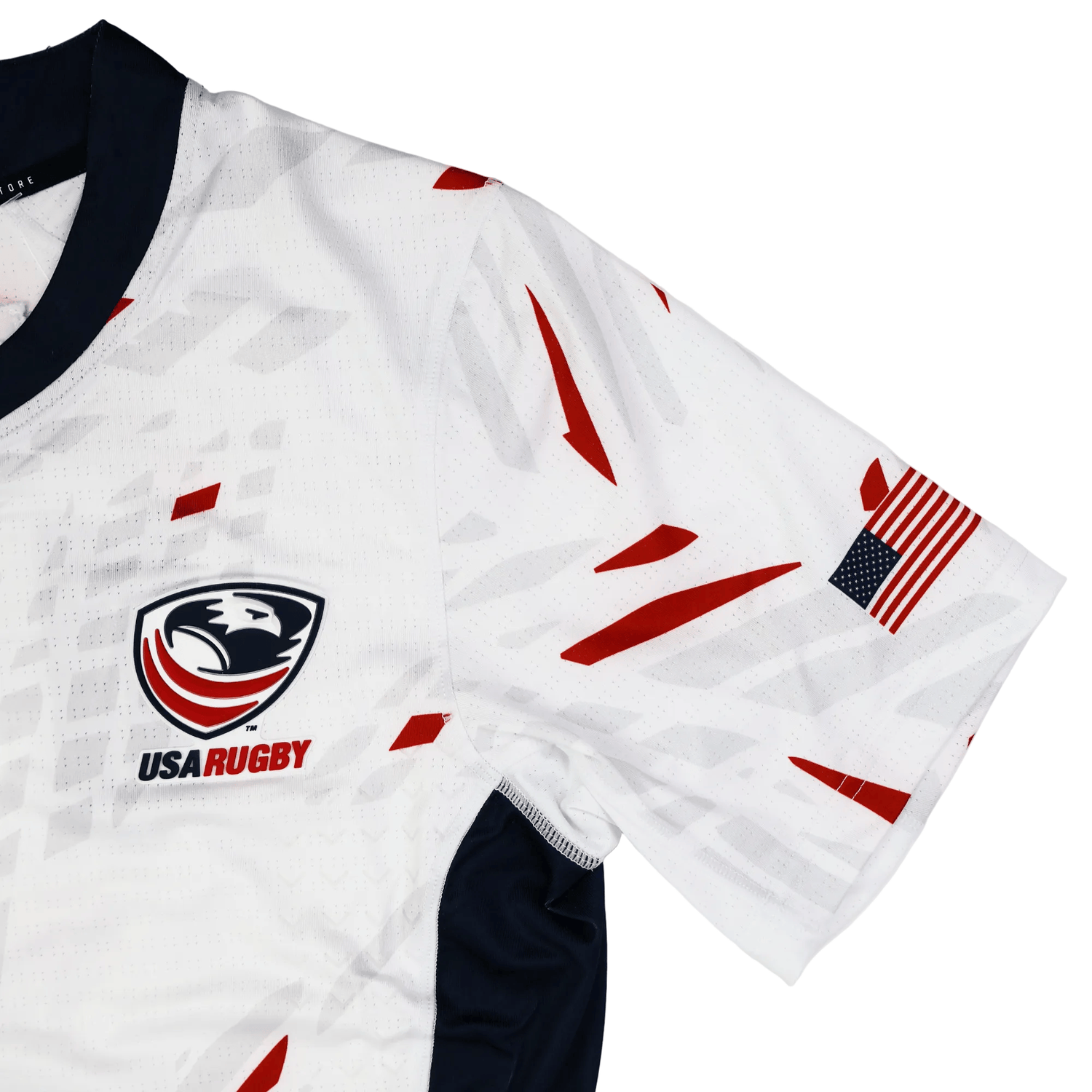 The USA Rugby 23/24 Pro Away Jersey by Castore features red and gray geometric accents, the USA Rugby logo, and an American flag patch on the right sleeve.