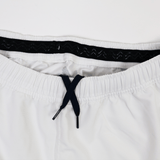 Close-up of the waistband on the Castore USA Rugby 23/24 Pro Away Short in white, featuring a black drawstring and inner elastic band, designed for USA Rugby athletes.