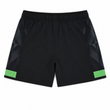 The Harlequins 23/24 Home Shorts by Castore, featuring a black design with green horizontal stripes near the hem and subtle geometric side patterns, are displayed flat on a white background.