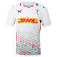 The Harlequins Replica Away Jersey 23/24 by Castore is a white rugby jersey with colorful diagonal stripes, DHL as main sponsor, and chest logos—ideal for any supporter.