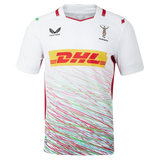 The Harlequins Replica Away Jersey 23/24 by Castore is a white rugby jersey with colorful diagonal stripes, DHL as main sponsor, and chest logos—ideal for any supporter.