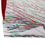 Close-up of the Harlequins Replica Away Jersey 23/24 by Castore, featuring diagonal multicolored lines and a small printed coordinate "51.4504°N, 0.3442°W" near the hem.