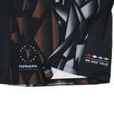 Close-up of the Harlequins 23/24 Pro 3rd Jersey by Castore, showing geometric patterns, Harlequins Foundation logo, and the phrases "WE ARE TRUE" and "NUNQUAM DORMIO 1866.