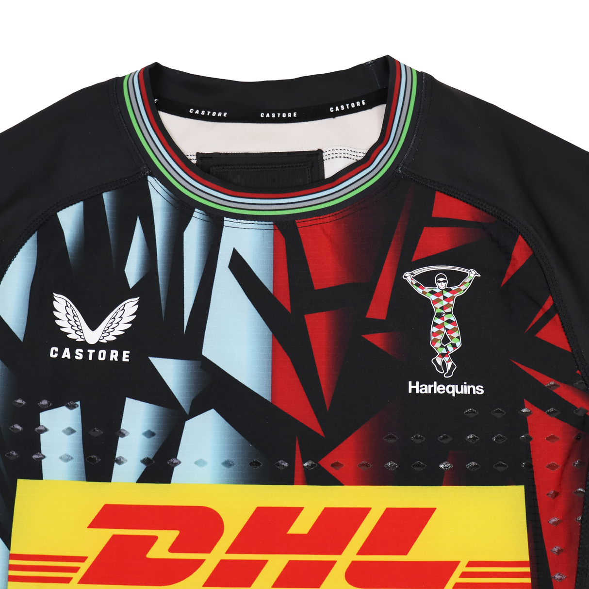 Close-up of the Harlequins 23/24 Pro 3rd Jersey by Castore, showcasing a bold geometric design, Castore and DHL logos, and the iconic team crest on the chest.