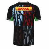 The Harlequins 23/24 Pro 3rd Jersey by Castore features short sleeves, an abstract black, blue, and red geometric design, green sleeve cuffs, and a yellow DHL logo on the upper back.