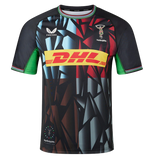The Harlequins 23/24 Replica Third Jersey by Castore features a geometric black, blue, and red design with green accents, DHL front sponsor logo, and moisture-wicking fabric for comfort on and off the pitch.