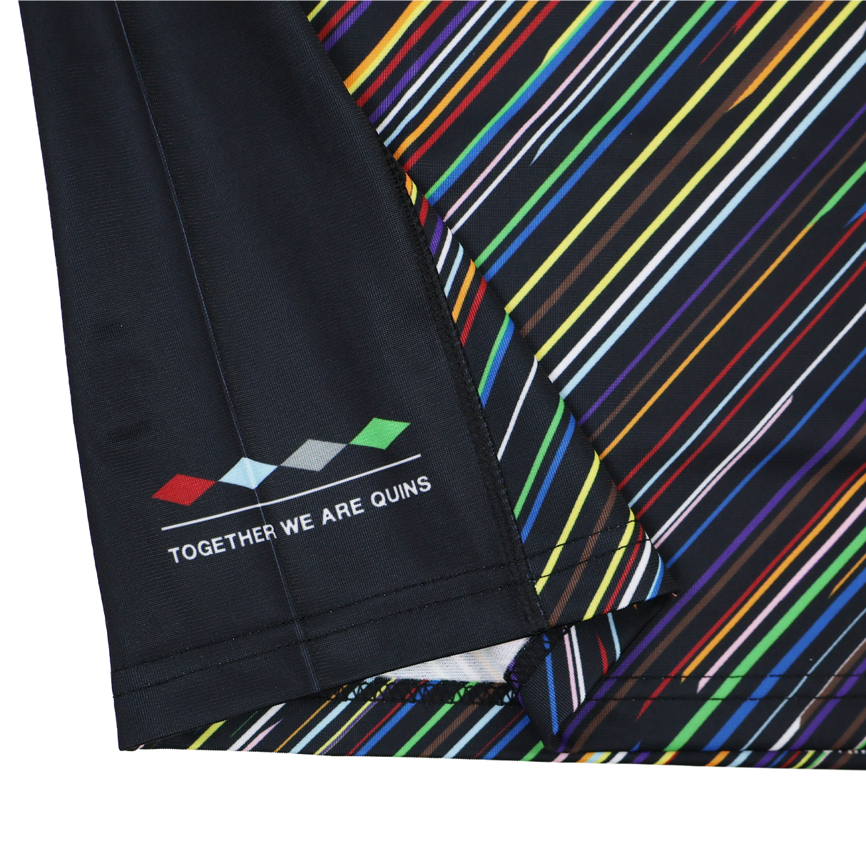 Close-up of the Harlequins Replica Pride Jersey 23/24 by Castore, featuring multicolored diagonal stripes and "TOGETHER WE ARE QUINS" beside five colored diamonds.