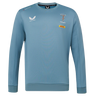 The Harlequins 23/24 Training Sweatshirt by Castore features long sleeves, rugby and DHL logos, Castore branding, and green, red, and blue trim on the light blue collar.