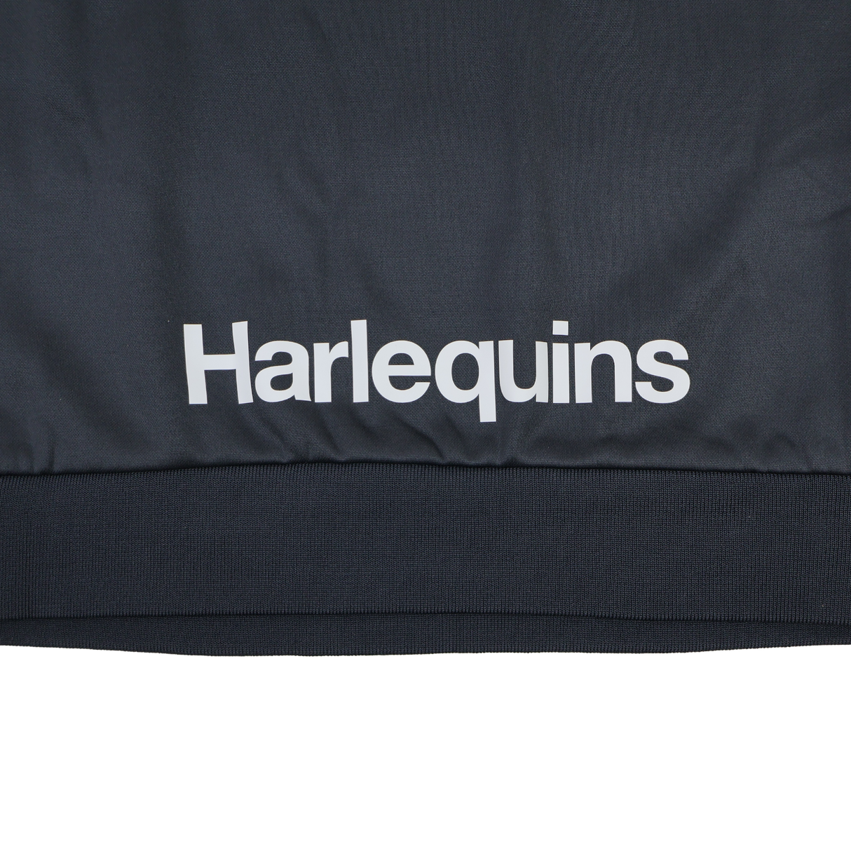 The Harlequins 23/24 Training Sweatshirt by Castore features "Harlequins" printed in white on dark fabric and is part of Castore's official training apparel.
