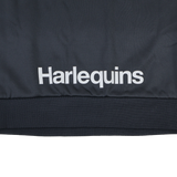 The Harlequins 23/24 Training Sweatshirt by Castore features "Harlequins" printed in white on dark fabric and is part of Castore's official training apparel.