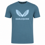 The Harlequins 23/24 Cotton Logo Tee by Castore is a blue cotton shirt featuring a white winged Harlequins logo above "HARLEQUINS" in capitals on the front.