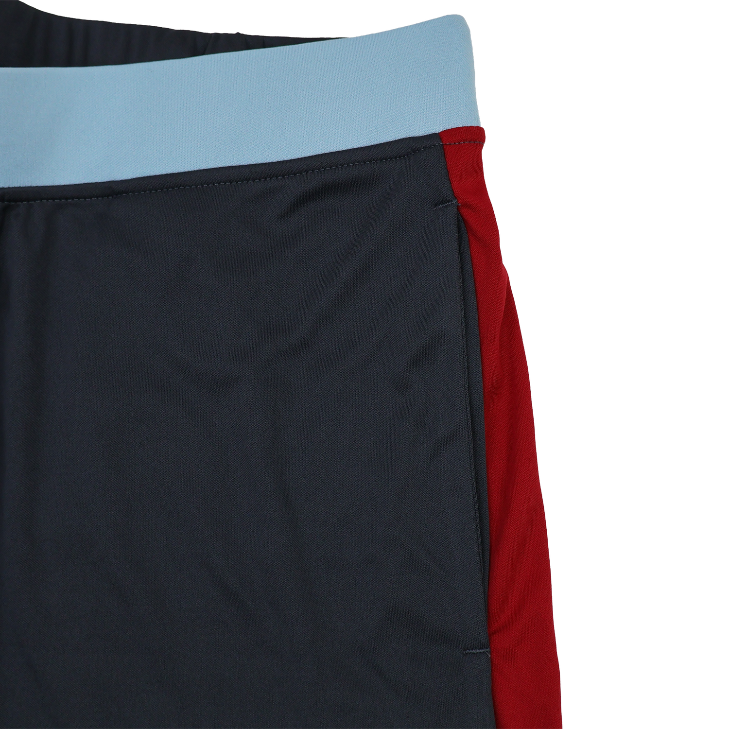 Close-up of Harlequins 23/24 Gym Short by Castore, featuring a light blue waistband, dark navy front panel, and red side panel—designed by Castore for optimal performance and style.