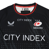 The Saracens Pro Home Jersey 23/24 by Castore features red and white trim, City Index sponsor logo, Castore branding, and the Saracens team emblem on the chest.