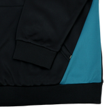 Close-up of the Bath 23/24 Hoodie by Castore showing the black sleeve with ribbed cuff and teal blue side panel, highlighting detailed stitching—a must-see for fans of Castore’s Bath Rugby gear.