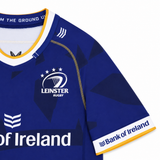 The Leinster 23/24 Replica Home Jersey by Castore showcases the team logo, three stars, Bank of Ireland sponsor, and yellow trim. This official Castore jersey is ideal for any Leinster Rugby supporter.