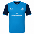 The Leinster 23/24 SS Travel Tee by Castore features blue and navy colors, short sleeves, Castore logo, Bank of Ireland sponsor, and the Leinster Rugby crest on the chest.