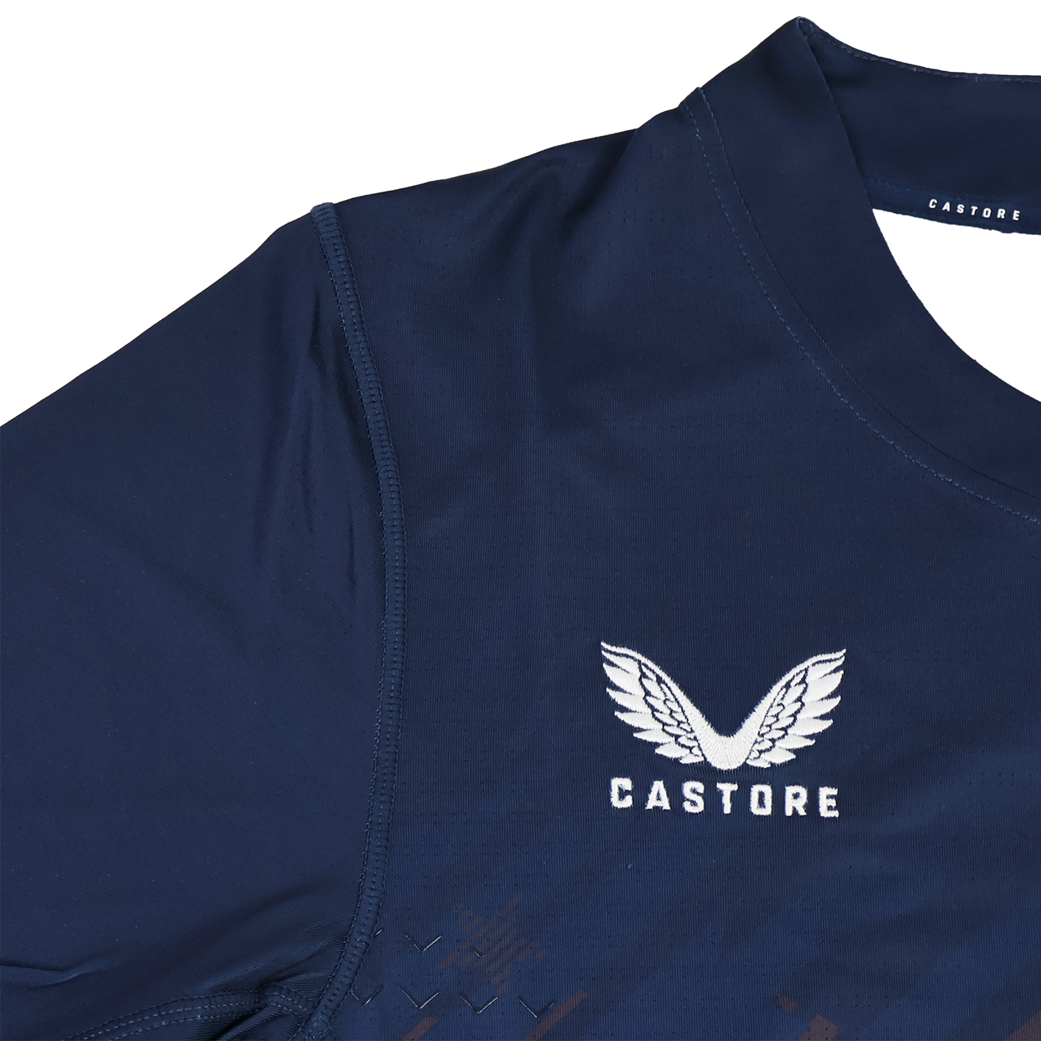 The USA Rugby 24/25 Pro Home Jersey by Castore features navy blue fabric, white embroidered Castore wings and "CASTORE" text on the chest, inspired by the official USA Rugby design.