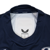 Close-up of the collar and neckline on the Castore USA Rugby 24/25 Pro Home Jersey, featuring inner tags and logo—an authentic detail from this official rugby jersey by Castore.